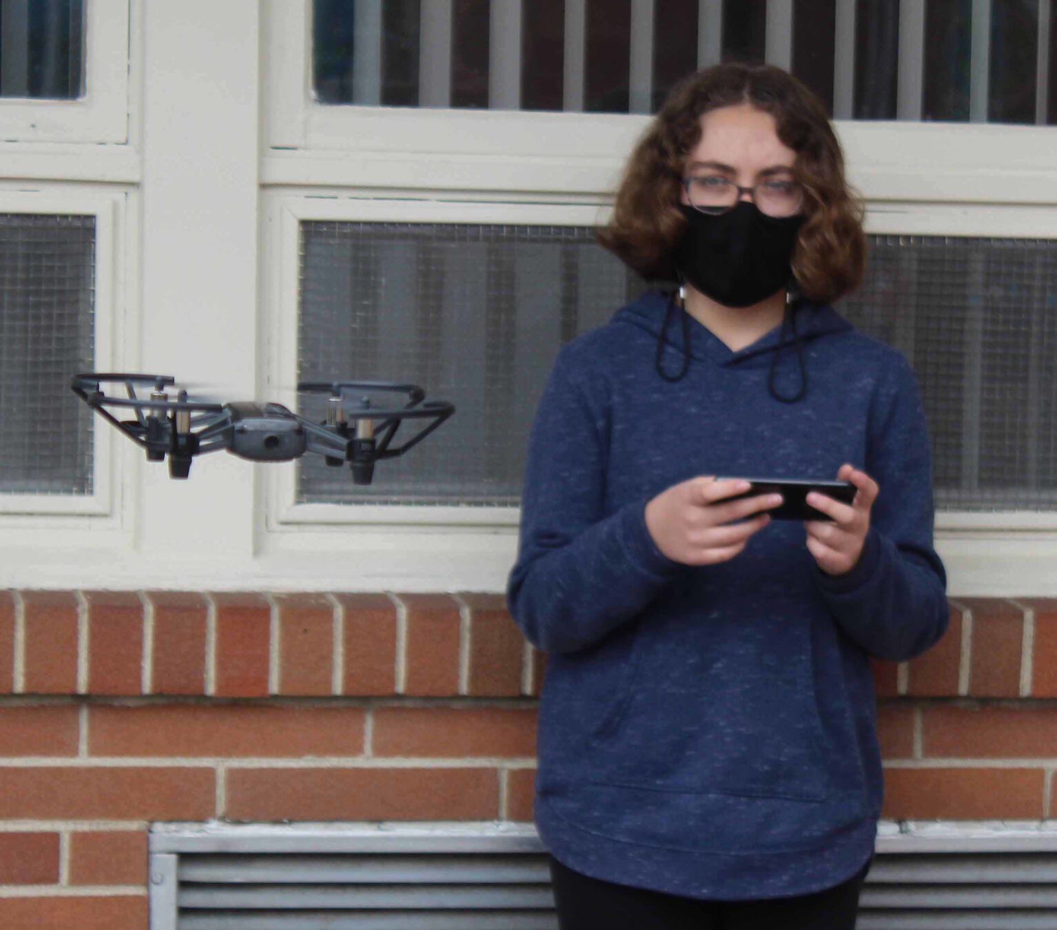 Olivia watches drone